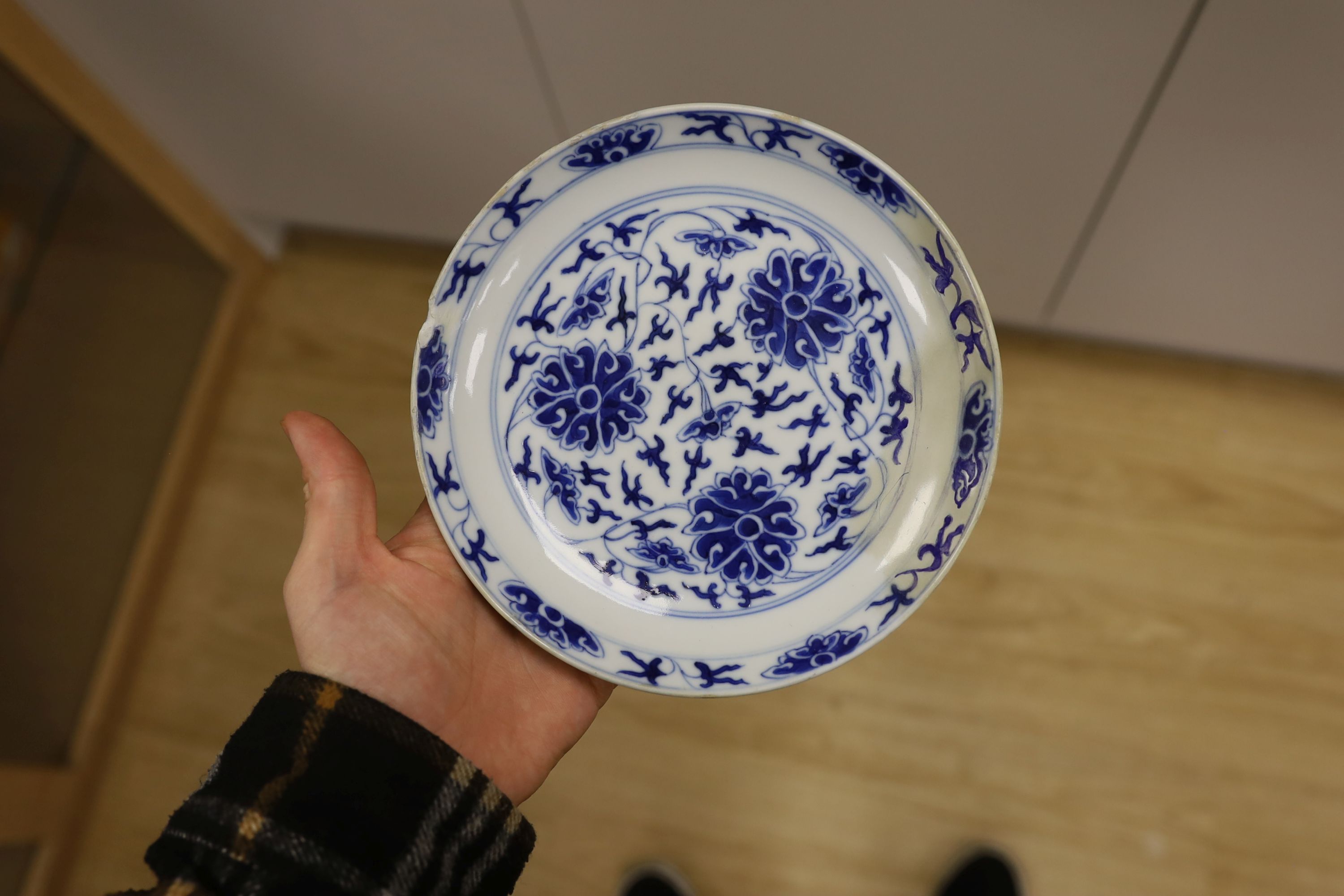 A Chinese underglaze copper red ‘herder and goats’ vase, Kangxi six character mark but Republic period and a Chinese blue and white lotus stem dish, six character Guangxu mark and period, both damaged